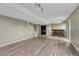 Large open basement area, featuring wood-look flooring and a custom bar at 3689 Primrose Ln, Castle Rock, CO 80109