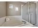 Bathroom showcasing a large soaking tub with a clear glass shower surround at 3689 Primrose Ln, Castle Rock, CO 80109
