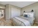 Cozy bedroom features carpet flooring, a closet with white doors, and a stylish decorative headboard at 3689 Primrose Ln, Castle Rock, CO 80109