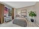 Cozy bedroom with large window and bench seating at 3689 Primrose Ln, Castle Rock, CO 80109