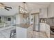 Bright kitchen features granite counters, stainless appliances and an island with seating at 3689 Primrose Ln, Castle Rock, CO 80109