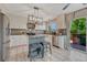 Bright kitchen features granite counters, stainless appliances and access to the outdoor deck at 3689 Primrose Ln, Castle Rock, CO 80109