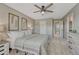 Spacious main bedroom features neutral carpet, a ceiling fan and decor accents at 3689 Primrose Ln, Castle Rock, CO 80109