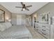 Well-lit main bedroom leads to an en suite bathroom, with neutral carpet and decor accents at 3689 Primrose Ln, Castle Rock, CO 80109