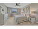 Well-lit main bedroom features neutral carpet, a ceiling fan and large windows at 3689 Primrose Ln, Castle Rock, CO 80109