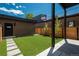 Serene backyard with artificial turf, modern fencing, and access to a rooftop deck at 21 Washington Ave, Golden, CO 80403