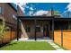Exterior view of a backyard featuring a wooden fence, artificial grass, and modern design at 21 Washington Ave, Golden, CO 80403