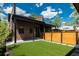 Outdoor space with artificial turf, wooden fence, and upper level deck at 21 Washington Ave, Golden, CO 80403