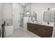 Modern bathroom with double vanity, glass-enclosed shower, and freestanding tub at 21 Washington Ave, Golden, CO 80403