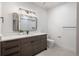 Modern bathroom featuring dark wood vanity, white countertop, and rectangular mirror at 21 Washington Ave, Golden, CO 80403