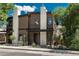 Beautiful home featuring a wood facade, stone accents, front porch, and manicured landscaping at 21 Washington Ave, Golden, CO 80403