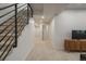 Basement hallway next to stairs and finished living room at 21 Washington Ave, Golden, CO 80403