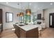 Gourmet kitchen view into the living room featuring modern pendant lights and white countertop island at 21 Washington Ave, Golden, CO 80403