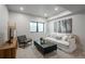 Cozy living room with a comfortable sofa, stylish coffee table, and large window for natural light at 21 Washington Ave, Golden, CO 80403