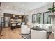 Bright living room featuring modern white furniture, wood flooring, and lots of natural light at 21 Washington Ave, Golden, CO 80403
