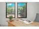 Inviting office area with large windows offering views of greenery and a rustic-style desk at 21 Washington Ave, Golden, CO 80403