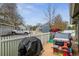 Backyard featuring a deck, playhouse, grill, and white picket fence at 10474 W Purgatoire Peak, Littleton, CO 80127
