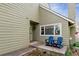 Inviting exterior featuring a charming entrance with blue rocking chairs and landscaped flowerbeds at 10474 W Purgatoire Peak, Littleton, CO 80127