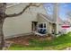 Charming exterior of home with landscaped yard, mature tree, and cozy front porch at 10474 W Purgatoire Peak, Littleton, CO 80127