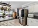 Bright eat-in kitchen with stainless steel appliances, ample storage, and an island at 10474 W Purgatoire Peak, Littleton, CO 80127