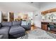 Inviting living room with a gray sofa, hardwood floors, and plenty of natural light at 10474 W Purgatoire Peak, Littleton, CO 80127