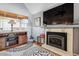 Inviting living room with fireplace, wooden accents, and large windows at 10474 W Purgatoire Peak, Littleton, CO 80127