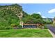 Entrance sign for Ken-Caryl Ranch with mountain views and lush landscaping at 10474 W Purgatoire Peak, Littleton, CO 80127