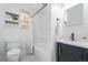Clean bathroom featuring a shower/tub combo with white subway tile and a modern vanity at 3050 N Marion St, Denver, CO 80205
