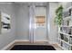 Bedroom with stylish bookshelf, artwork, and natural light at 3050 N Marion St, Denver, CO 80205