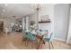 Bright dining room with a modern chandelier, shiplap accent wall, and elegant decor at 3050 N Marion St, Denver, CO 80205