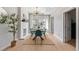 Sunlit dining room with a modern chandelier and a view of the backyard at 3050 N Marion St, Denver, CO 80205