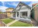 Craftsman-style home with a cozy front porch and artificial turf for easy maintenance at 3050 N Marion St, Denver, CO 80205