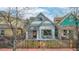 Charming home with a well-maintained front yard and cozy porch seating at 3050 N Marion St, Denver, CO 80205