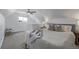 Bright main bedroom with neutral decor, sloped ceiling, and a ceiling fan for comfort at 3050 N Marion St, Denver, CO 80205