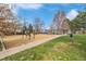 Community park featuring playground, picnic benches, and walking path at 3050 N Marion St, Denver, CO 80205