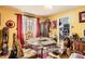 Cozy dining room featuring unique decor, a glass-top table, and a view into the kitchen at 2115 E 14Th Ave # 8, Denver, CO 80206