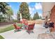 Backyard patio with lawn and garden shed; ideal for outdoor enjoyment and entertaining at 10525 W 18Th Ave, Lakewood, CO 80215
