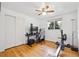Versatile room with hardwood floors, closet, and home gym area or office, filled with natural light at 10525 W 18Th Ave, Lakewood, CO 80215