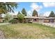 Lovely single-story home with a lush front lawn, mature trees and stone landscape accents at 10525 W 18Th Ave, Lakewood, CO 80215