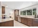 Modern kitchen features granite countertops, stainless steel appliances, and ample natural light at 10525 W 18Th Ave, Lakewood, CO 80215