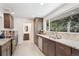 Updated kitchen with granite countertops, stainless steel appliances, and a view to the bathroom at 10525 W 18Th Ave, Lakewood, CO 80215