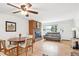 Inviting living space with hardwood floors, a brick fireplace, and a comfortable sofa, perfect for relaxation at 10525 W 18Th Ave, Lakewood, CO 80215