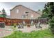 Backyard with a fire pit, Adirondack chairs, and a wooden fence, perfect for outdoor gatherings at 8229 Cottongrass Ct, Castle Pines, CO 80108