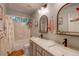 Bathroom featuring a marble countertop, double sink, bathtub, and neutral-colored tile at 8229 Cottongrass Ct, Castle Pines, CO 80108