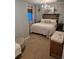 This bedroom offers a cozy feel with its wood headboard, and comfortable bedding at 8229 Cottongrass Ct, Castle Pines, CO 80108