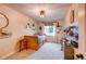 Bright bedroom features a large window, built-in bed frame, and playful decor at 8229 Cottongrass Ct, Castle Pines, CO 80108