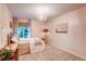 Cozy bedroom with a comfortable bed, decorative chandelier, and serene ambiance at 8229 Cottongrass Ct, Castle Pines, CO 80108