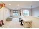 Bright bonus room featuring carpet, built-in desk, and window seats at 8229 Cottongrass Ct, Castle Pines, CO 80108