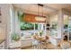 Charming breakfast nook with bench seating and a large window offering serene views of the backyard at 8229 Cottongrass Ct, Castle Pines, CO 80108