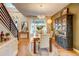 Elegant dining area featuring stylish decor, an adjacent staircase, and ample natural light at 8229 Cottongrass Ct, Castle Pines, CO 80108